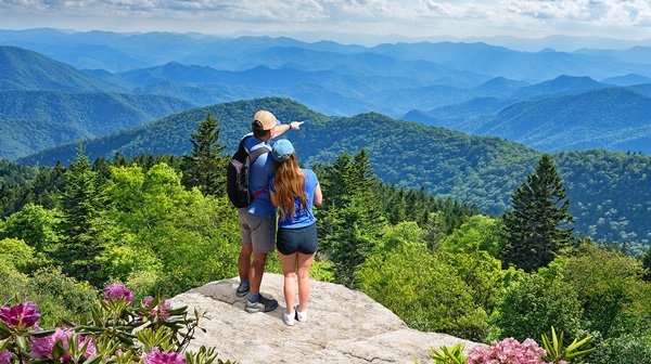 a couple is exploring north carolina